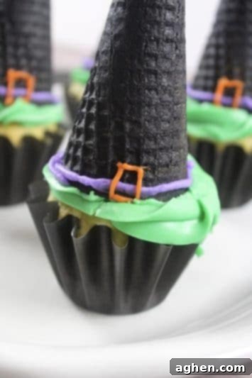 Spooky Witch Hat Cupcakes 4 Halloween witch hat cupcake made with an upside down ice cream cone and bright green frosting.