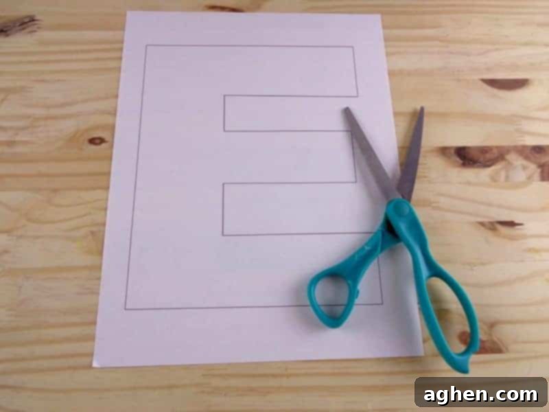 Carefully cut the Letter E out of the printed template, making sure to follow the lines accurately for a neat base for your craft.