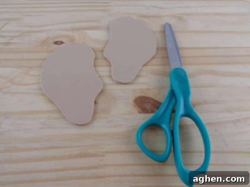Cut the ear shape from the template, then trace it twice onto your craft foam or cardstock. Finally, cut out both ear shapes to prepare for assembly.