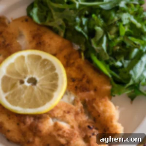 air fried chicken milanese on white plate