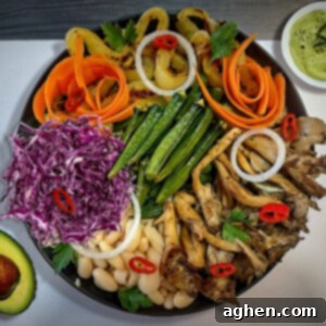 Buddha Bowl featuring okra and purple cabbage i black bowl.
