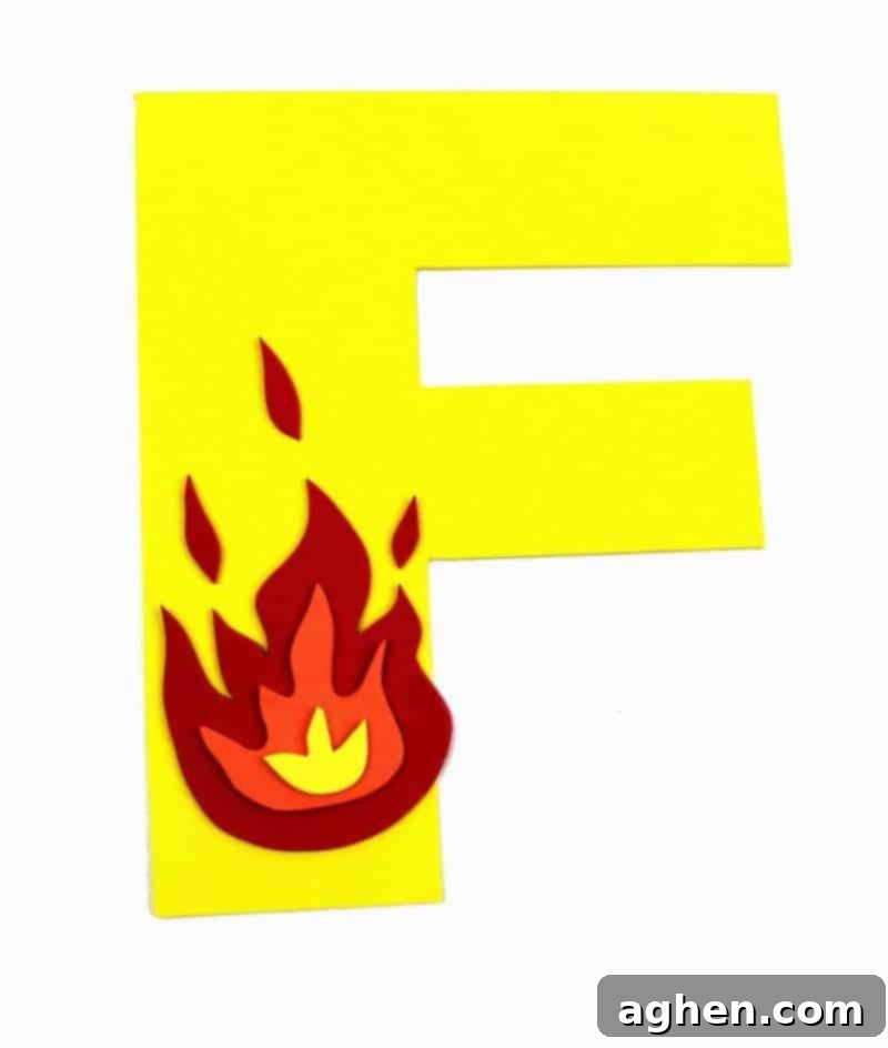The completed Letter F is for Fire craft, showcasing the vibrant layered flames on the yellow letter F.