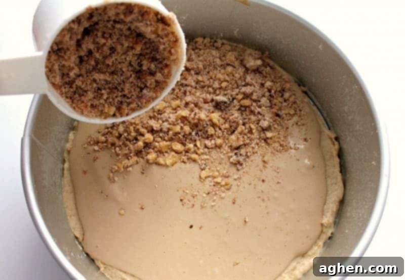 Layer of streusel sprinkled over the cream cheese filling in the coffee cake.