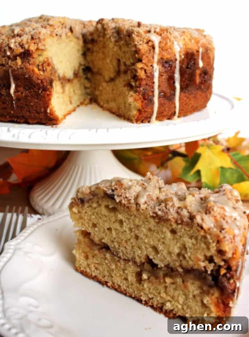 Fully baked and iced Maple Walnut Coffee Cake, sliced and ready to serve.