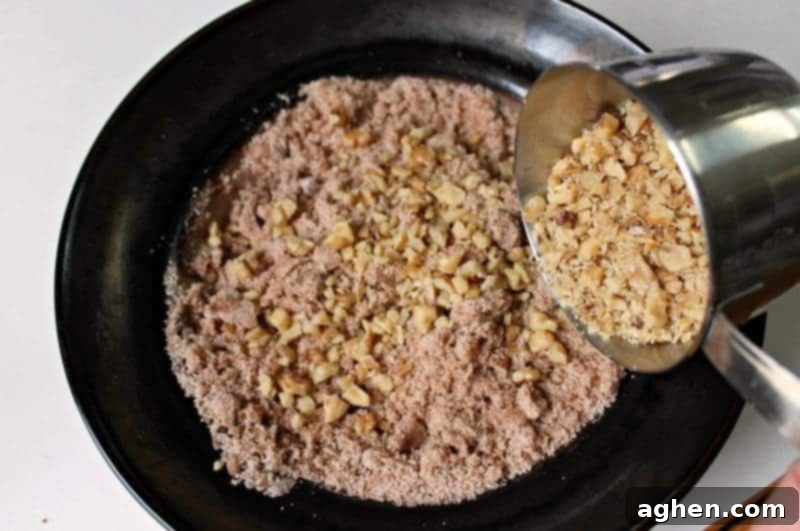 Bowl of streusel ingredients mixed together for Maple Walnut Coffee Cake.