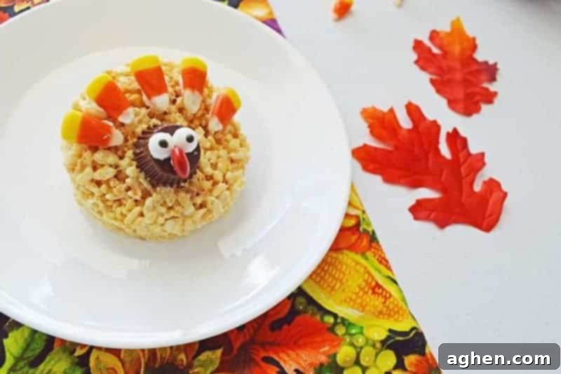 Adorable no-bake Rice Krispie Turkey Treats with candy corn feathers and peanut butter cup heads, perfect for a festive Thanksgiving dessert table.