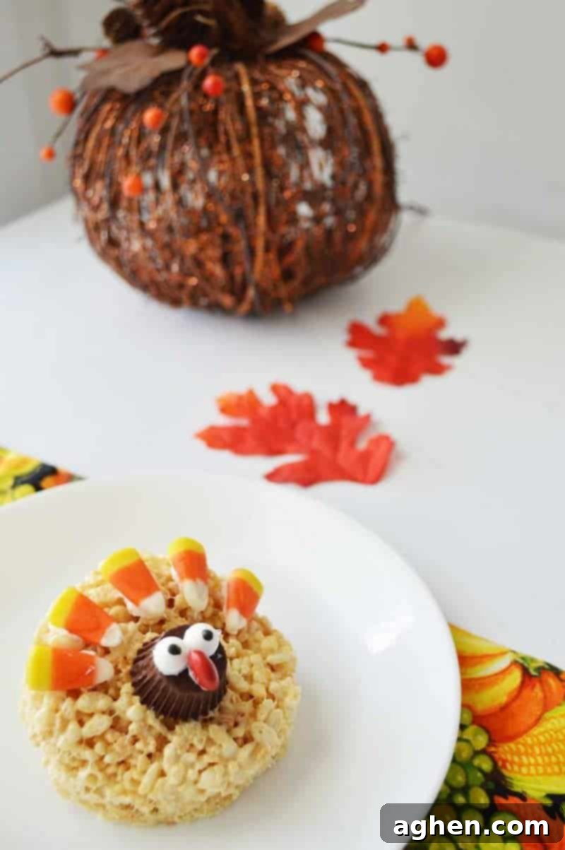 A close-up shot of ingredients for Rice Krispie Turkey Treats, including Rice Krispies, marshmallows, butter, peanut butter cups, candy eyes, M&Ms, and candy corn.