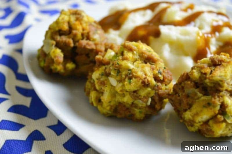 Golden brown Turkey and Stuffing Balls artfully arranged on a serving platter, garnished with fresh herbs