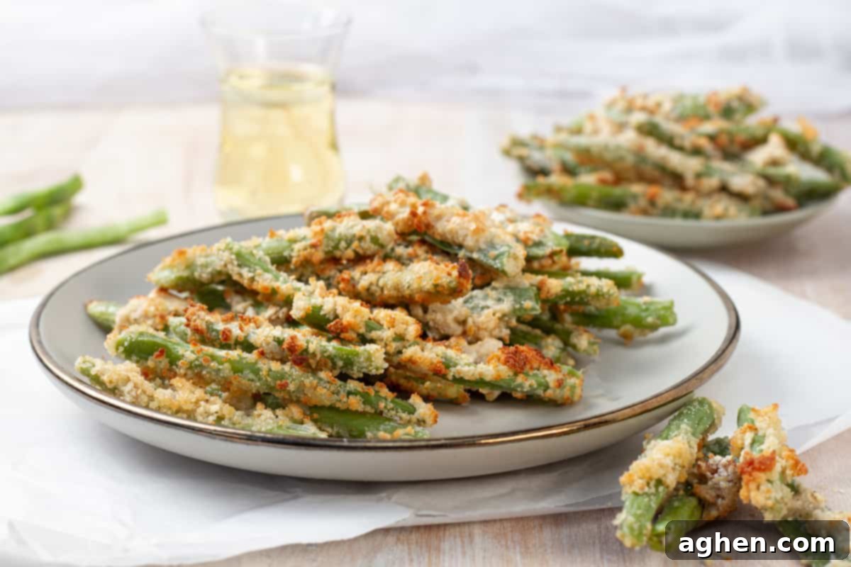 Crispy Air Fryer Green Bean Fries 2 Crispy green bean fries on a platter.
