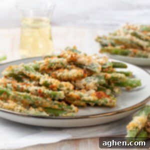 Crispy Air Fryer Green Bean Fries 3 Crispy green bean fries on a platter.