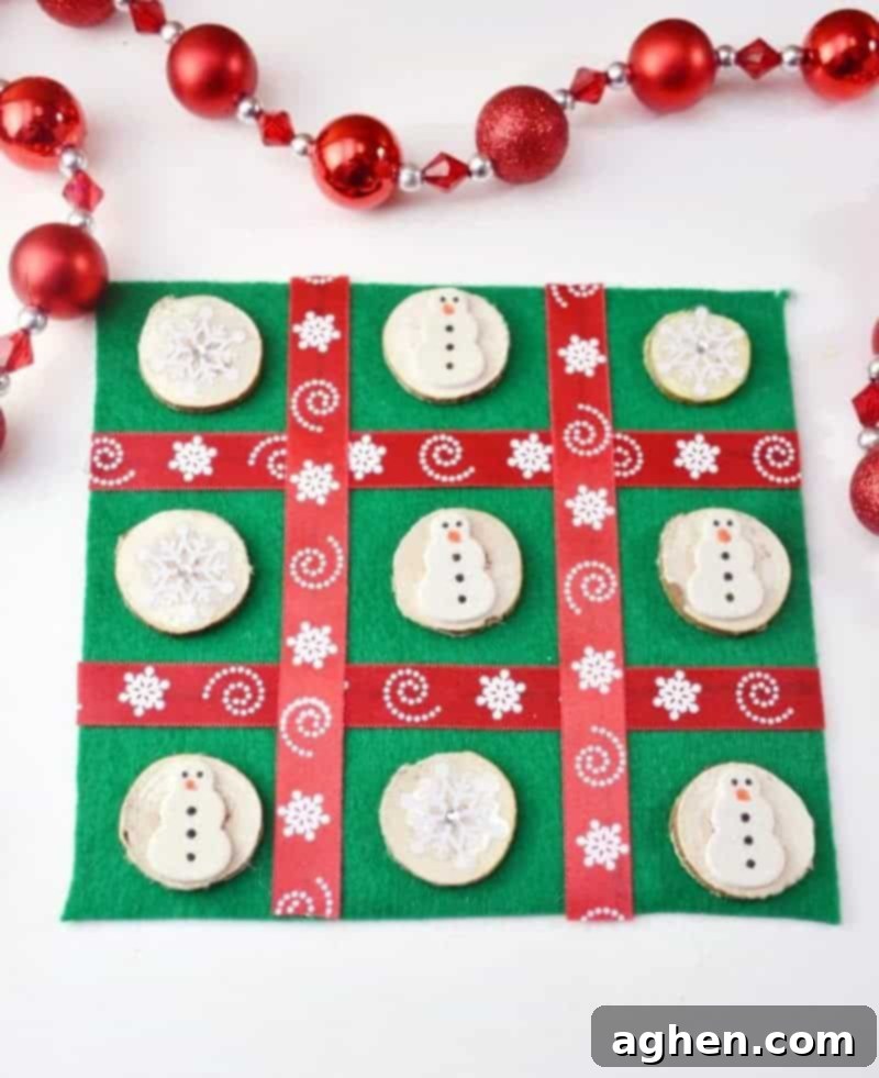 Handmade Christmas Tic Tac Toe board game with felt board and decorative wood slice pieces, perfect for gifting.