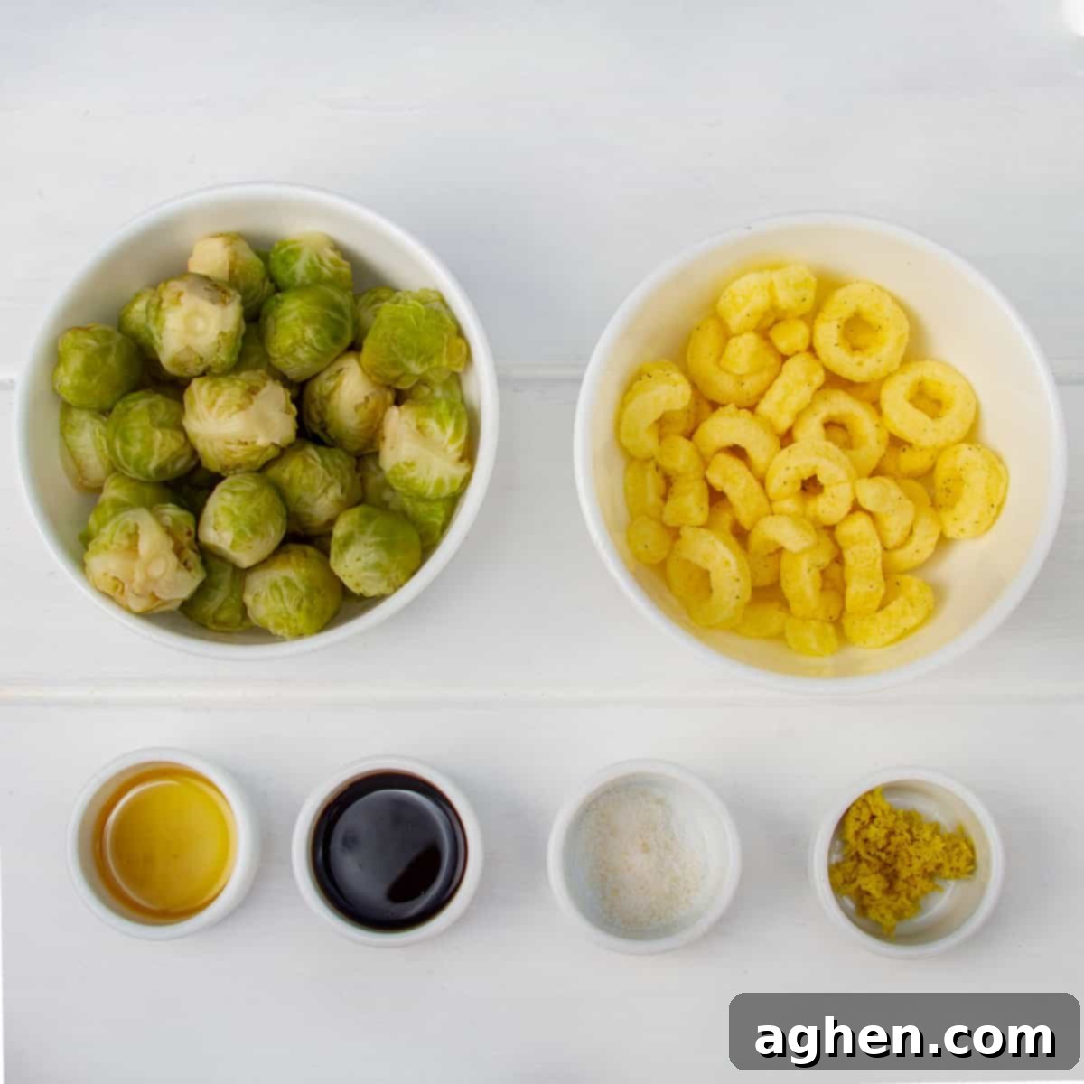 Red Lobster Style Crispy Brussels Sprouts 3 Collection of ingredients: halved Brussels sprouts in a bowl, crispy fried onions in a bowl, granulated stevia, minced fresh ginger, cornstarch, and reduced-sodium soy sauce in small dishes.