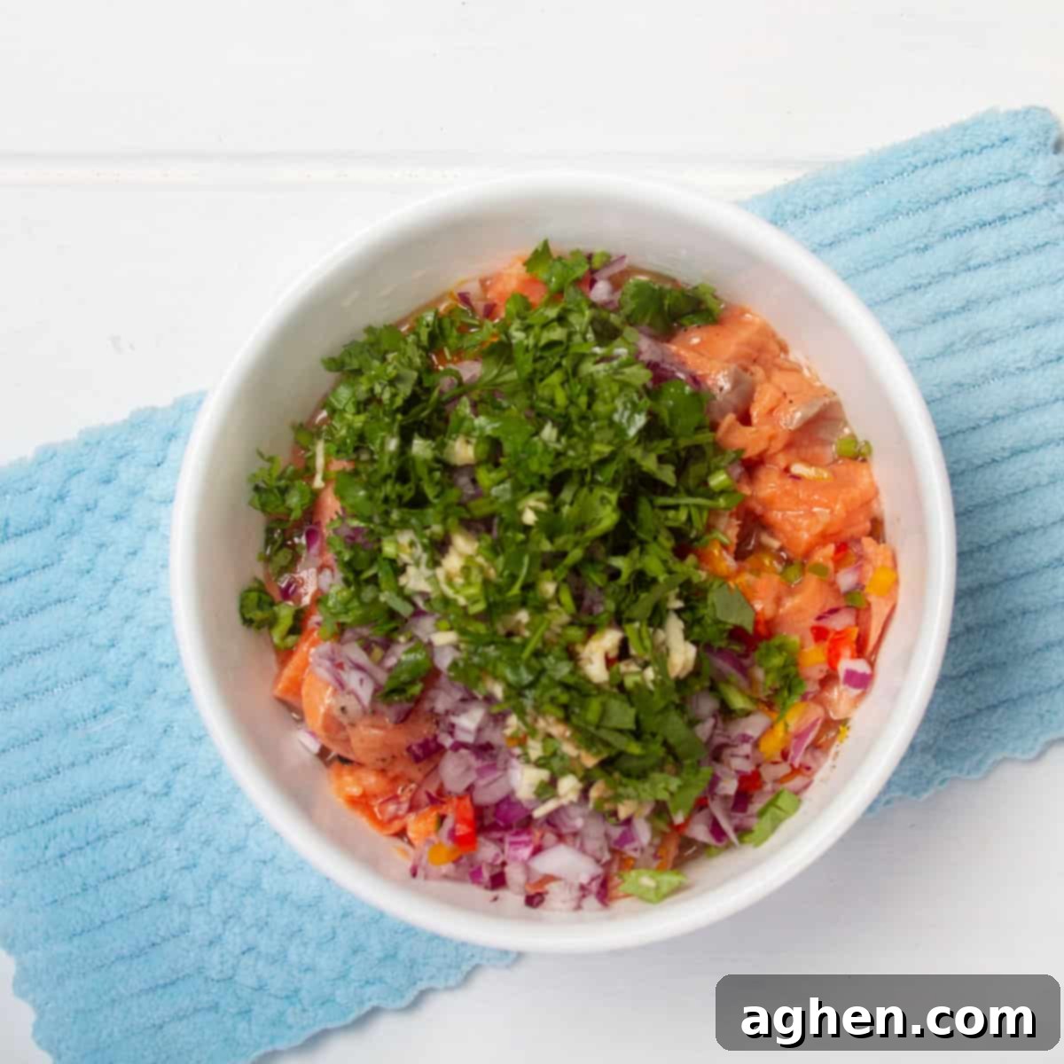 Chunks of fresh salmon topped with diced red onion, garlic, cilantro, and fresh chilis. 