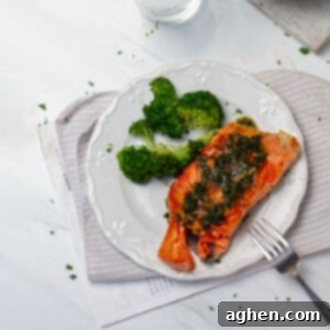 Herb Grilled Salmon (Olive Garden Copycat) with broccoli florets on a plate.