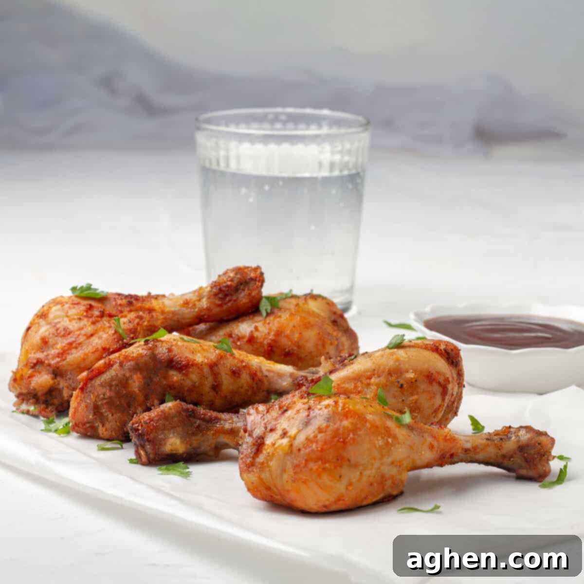 Crispy Air Fryer Chicken with fresh herb garnish.