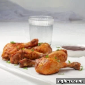 Crispy Air Fryer Chicken with fresh herb garnish.