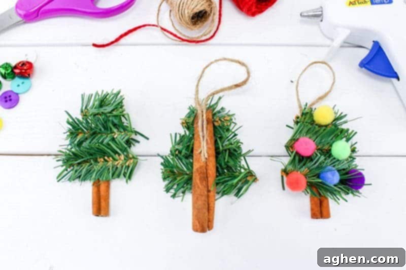 Step 3 of the DIY Christmas tree ornament craft, showing how to attach a twine hanger to the back of the cinnamon stick.