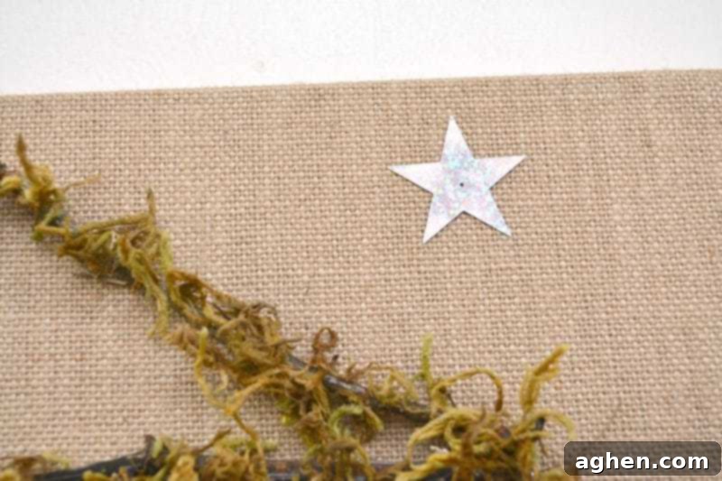 Adding the guiding star to the rock nativity canvas.