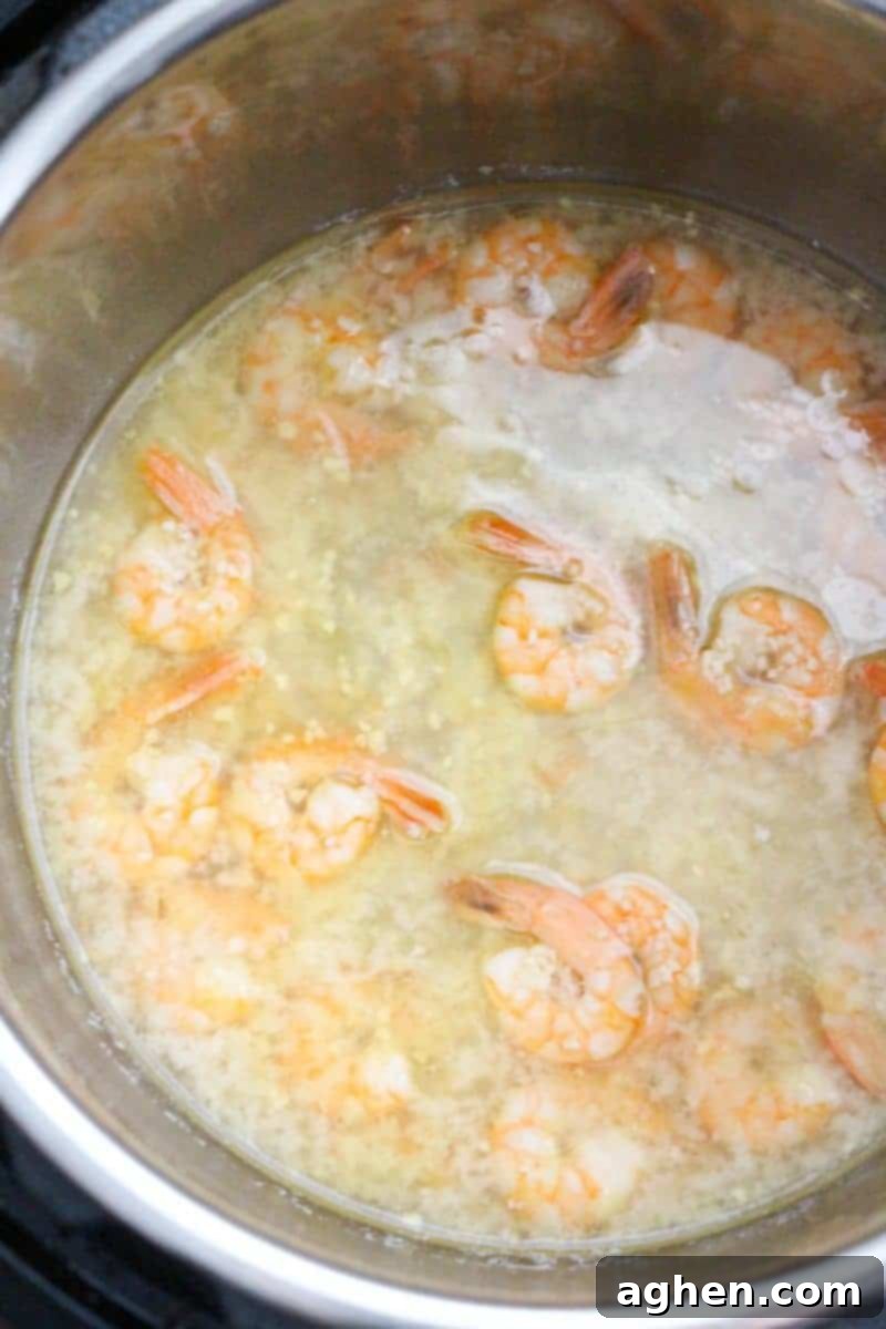 This delicious and simple instant pot shrimp scampi recipe takes minutes to make and can be served over pasta or rice for a quick and tasty dinner.