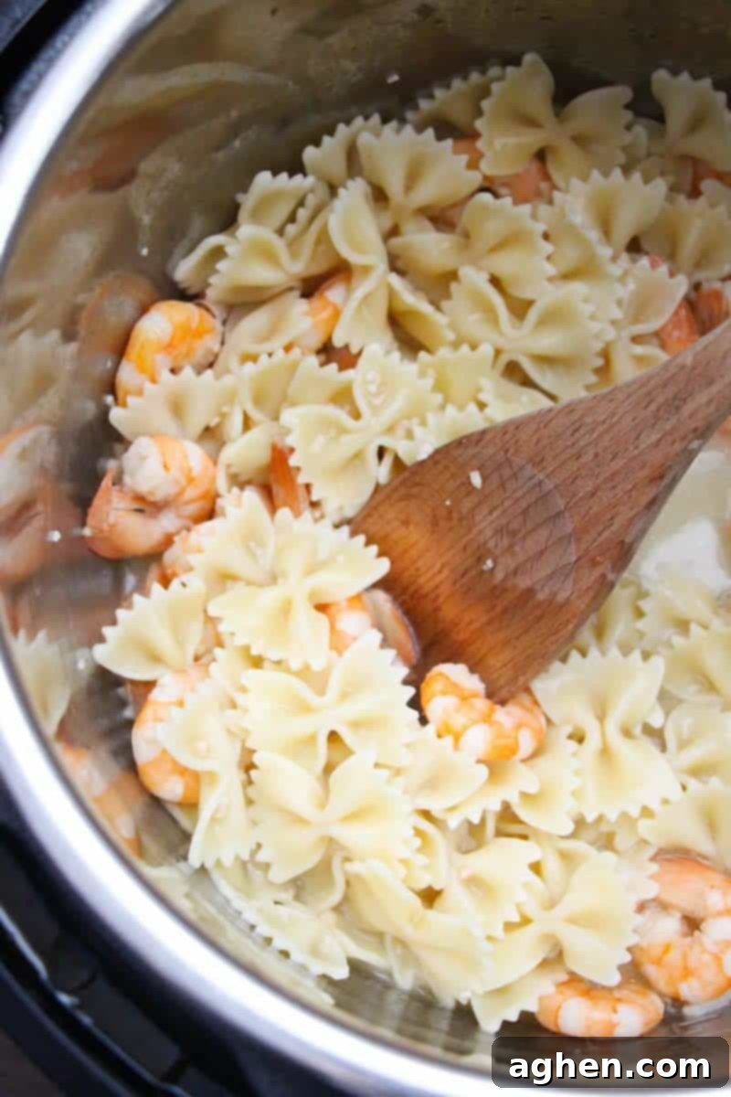 This delicious and simple instant pot shrimp scampi recipe takes minutes to make and can be served over pasta or rice for a quick and tasty dinner.