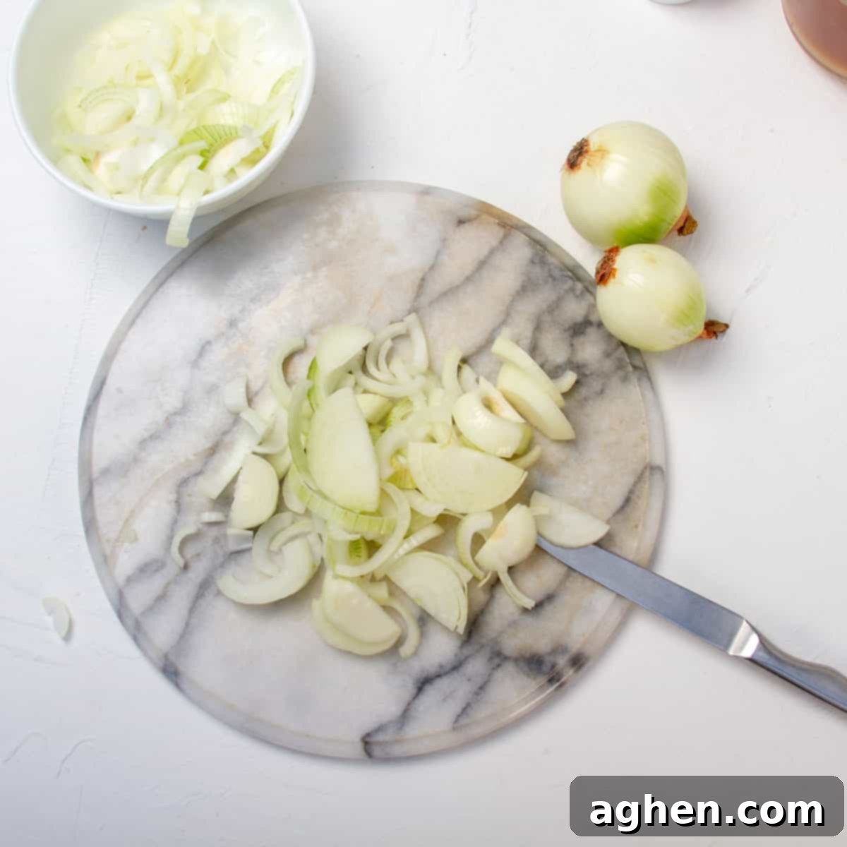 Savory WW Friendly French Onion Soup 4 Sliced onions on a cutting board.