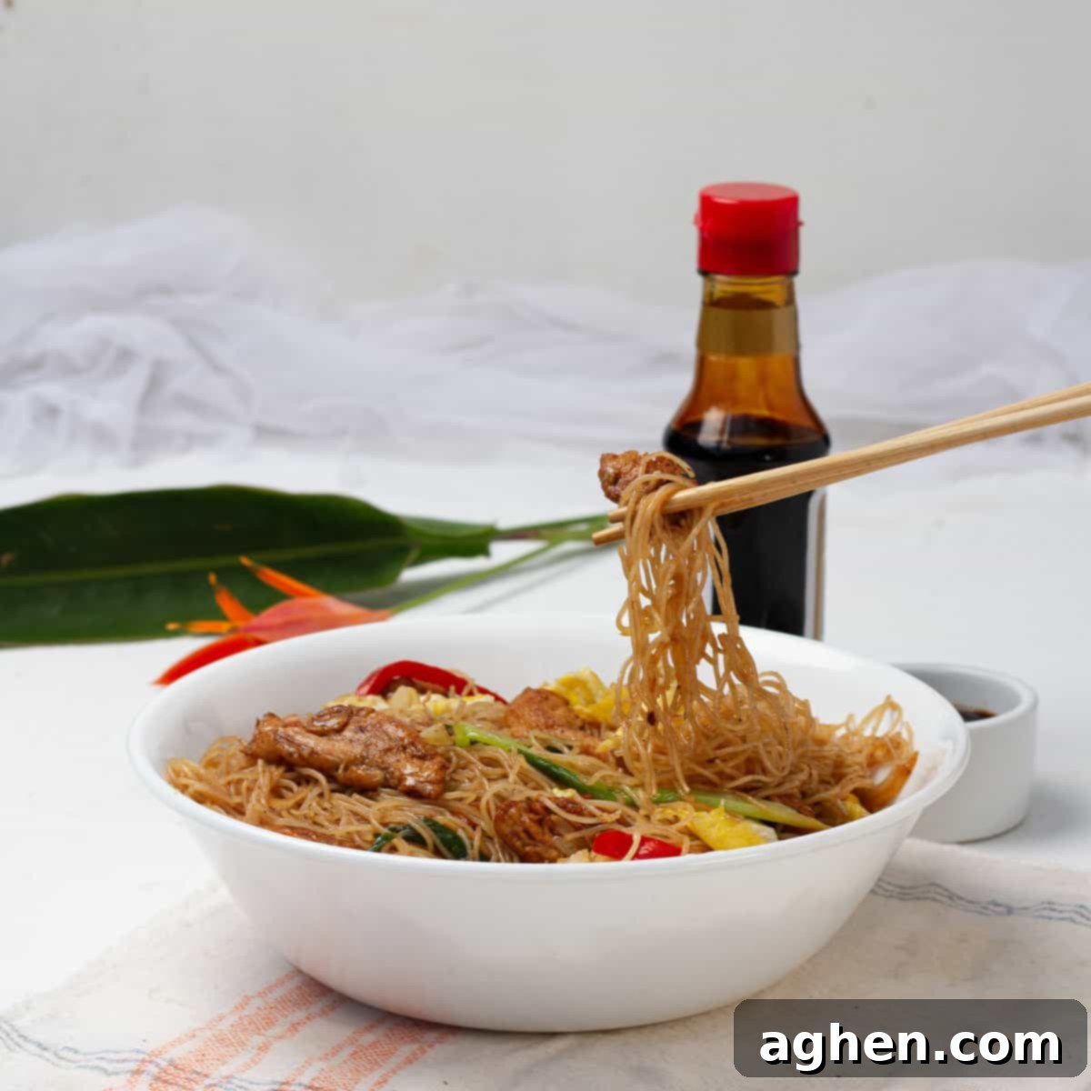 Thai Pad Woon Sen Stir Fry 2 A bowl of pad woon sen, or stir-fried glass noodles. The Thai dish is comprised of thin stir-fried noodles with colorful veggies in a brown sauce.