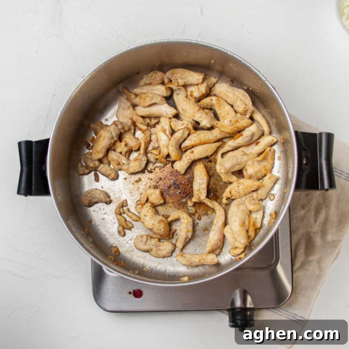 Thai Pad Woon Sen Stir Fry 7 Chicken stir-frying in a pan.