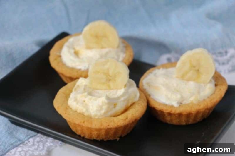 Finished banana cream cookie cups, beautifully garnished with banana slices, showcasing a perfect dessert for any occasion.