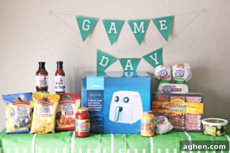 A fun and easy football themed party spread including a recipe for mini mac & cheese cups, a DIY Game Day banner printable, DIY Game Day toothpick topper printable, and printable football buffet table labels all available for download - perfect for your Big Game celebration!