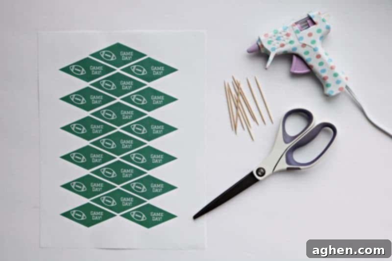 Materials needed for DIY Game Day toothpick toppers: printable flags, scissors, toothpicks, and glue gun.