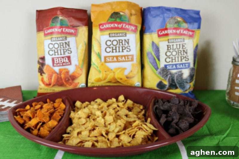 A bowl of delicious Garden of Eatin’® Chips, an organic and non-GMO snack option perfect for Game Day parties, offering tasty and healthier choices.