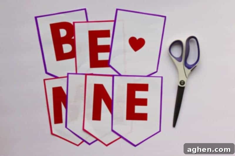 Step-by-step guide: Cutting out the letter flags from the "Be Mine" Valentine banner printable.