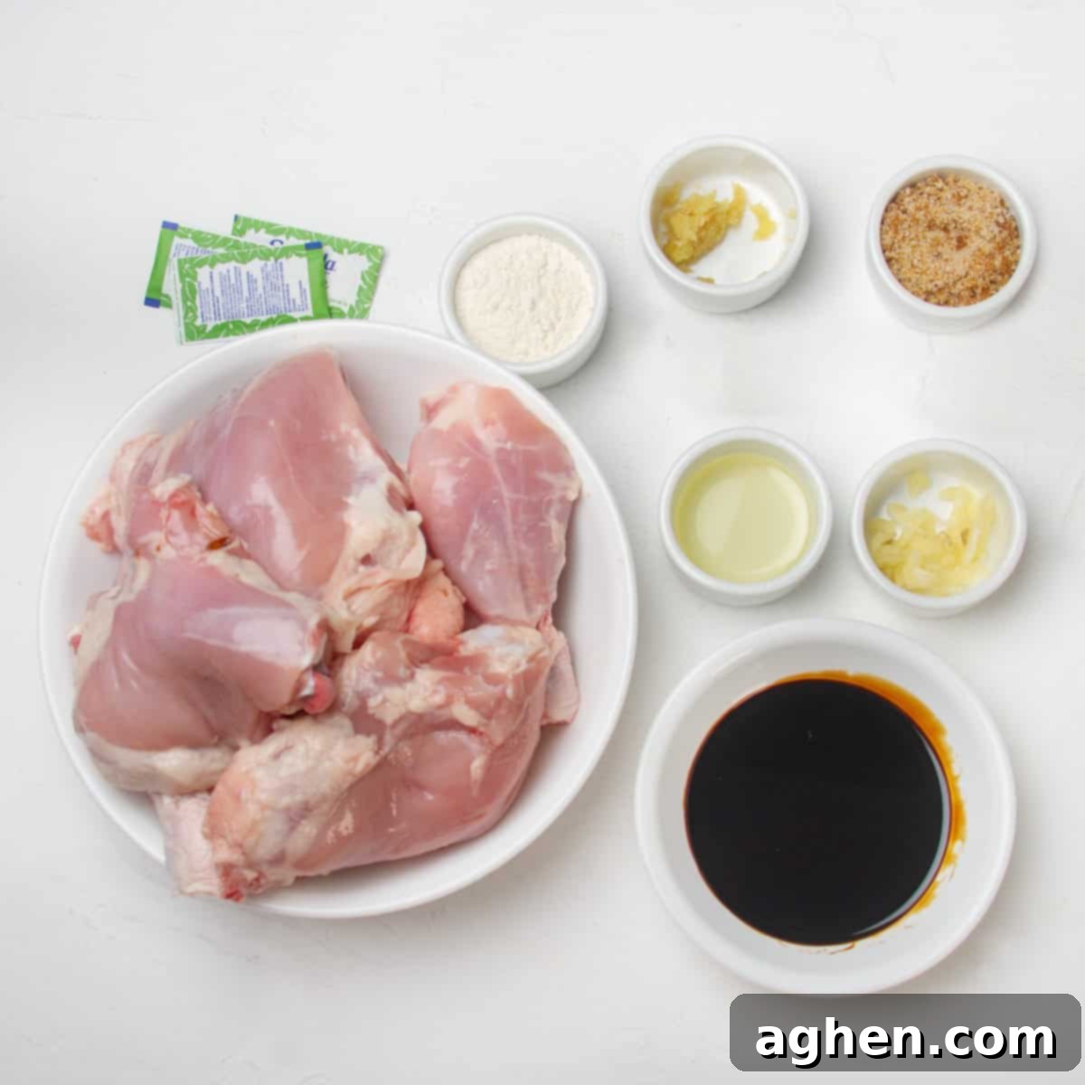 Raw boneless, skinless chicken thighs, low-sodium soy sauce, water, brown sugar, stevia packets, cornstarch, cooking oil, minced garlic, and fresh grated ginger.