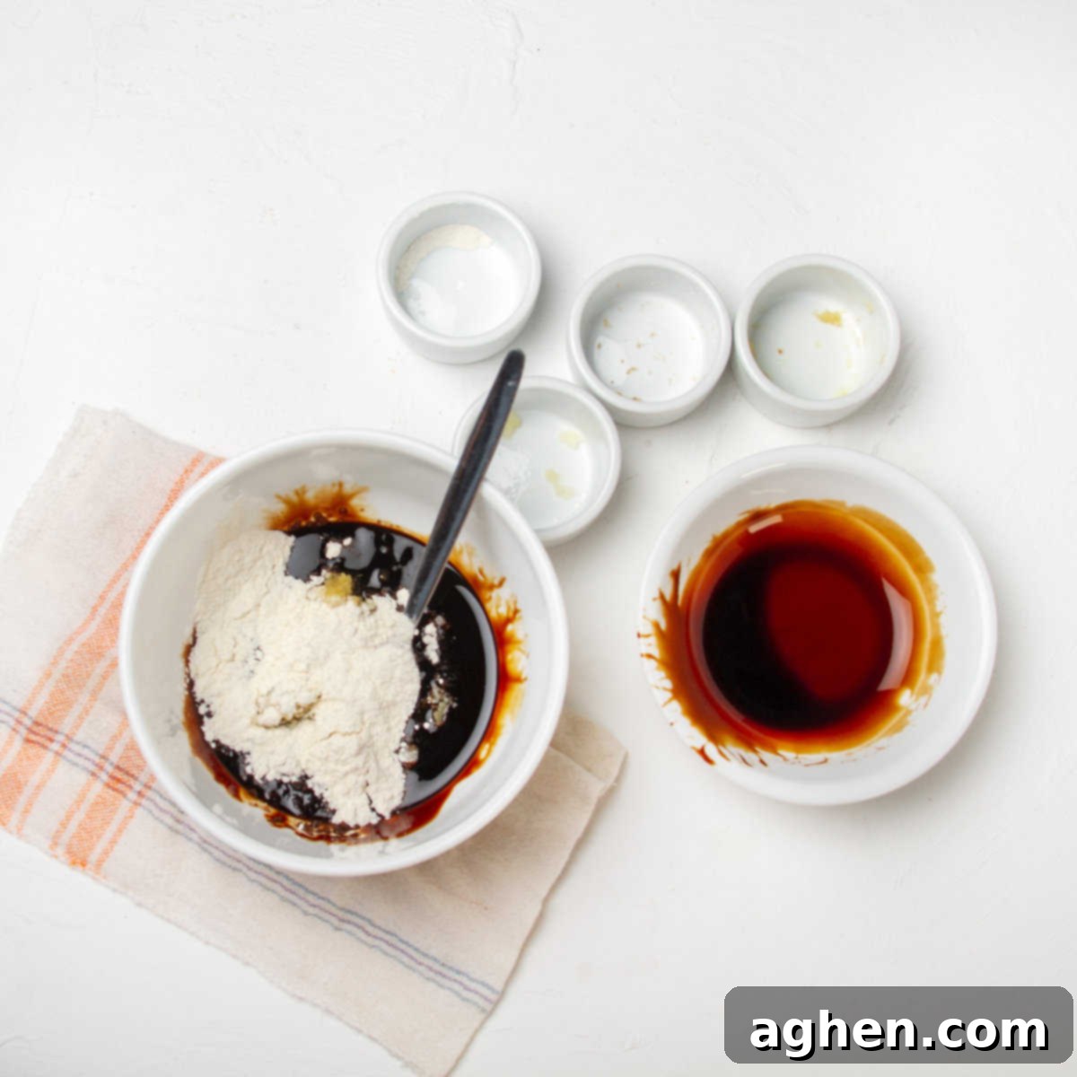 Soy sauce mixed with cornstarch, ginger, brown sugar, and stevia in a bowl.