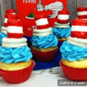 Whimsical Cat in the Hat Cupcakes for Dr Seuss Day 4 A square image showcasing a single Cat in the Hat cupcake with blue frosting and a distinctive red and white striped hat topper.