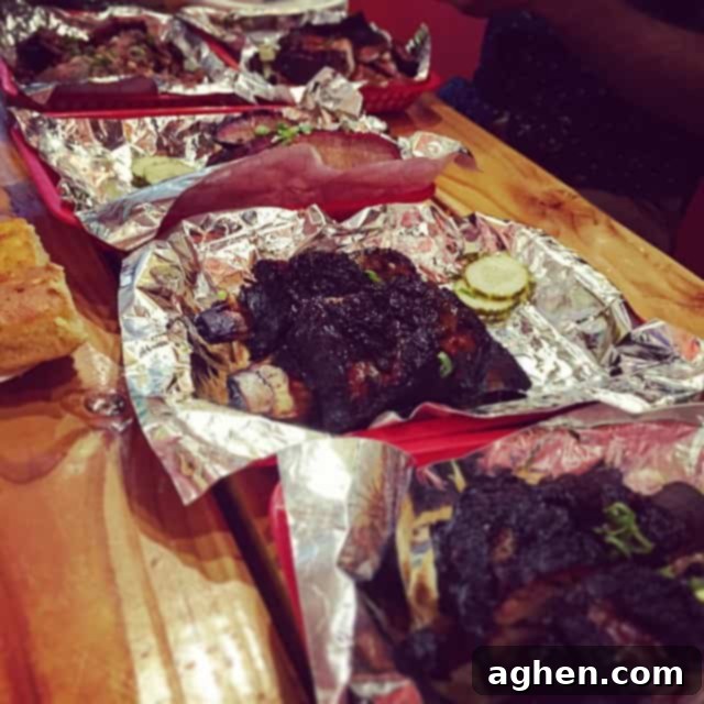 BBQ Feast from Rollin' Smoke in Austin, featuring a variety of smoked meats
