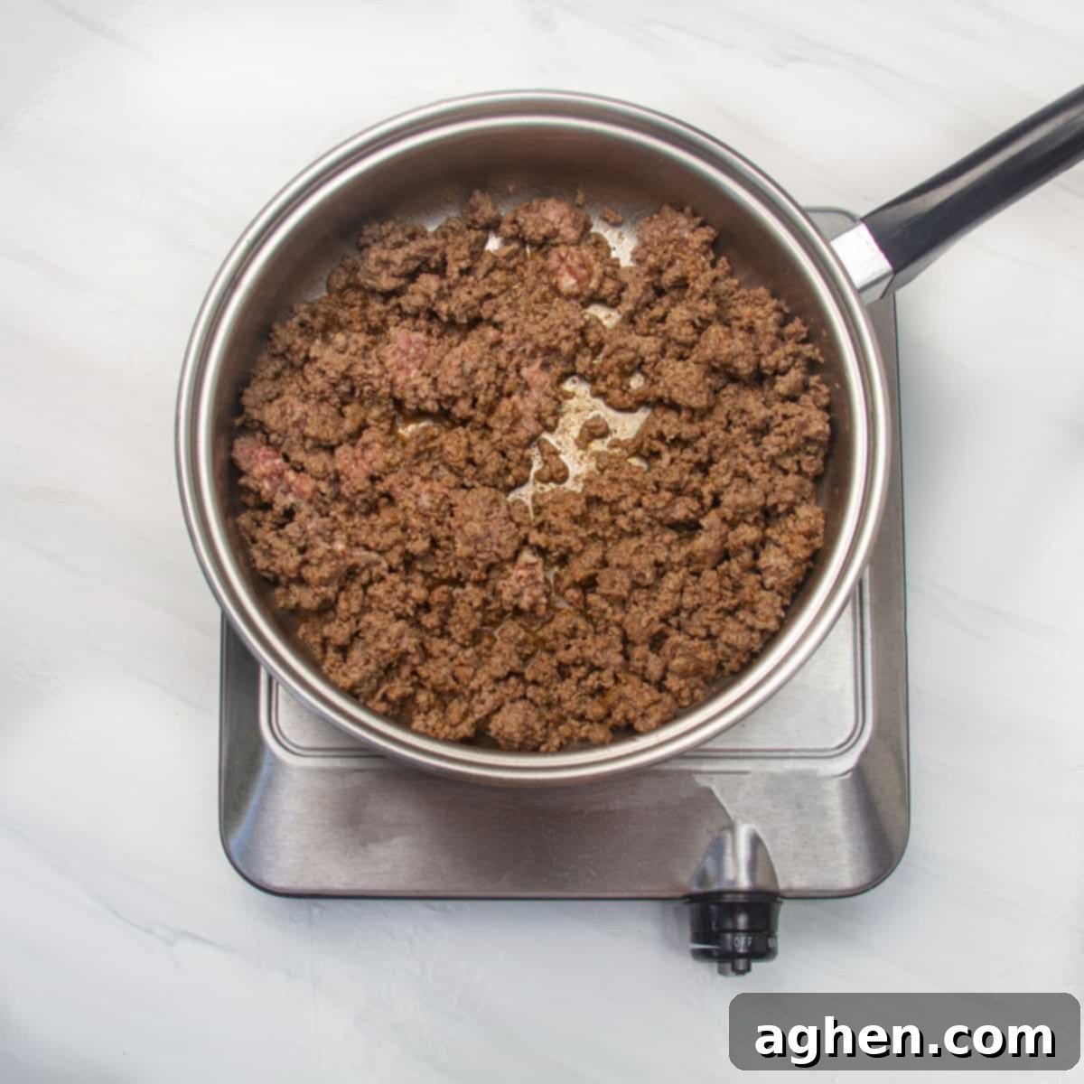 Simple Taco Casserole: Your Taco Night Game Changer 4 Ground beef cooking in a pan.