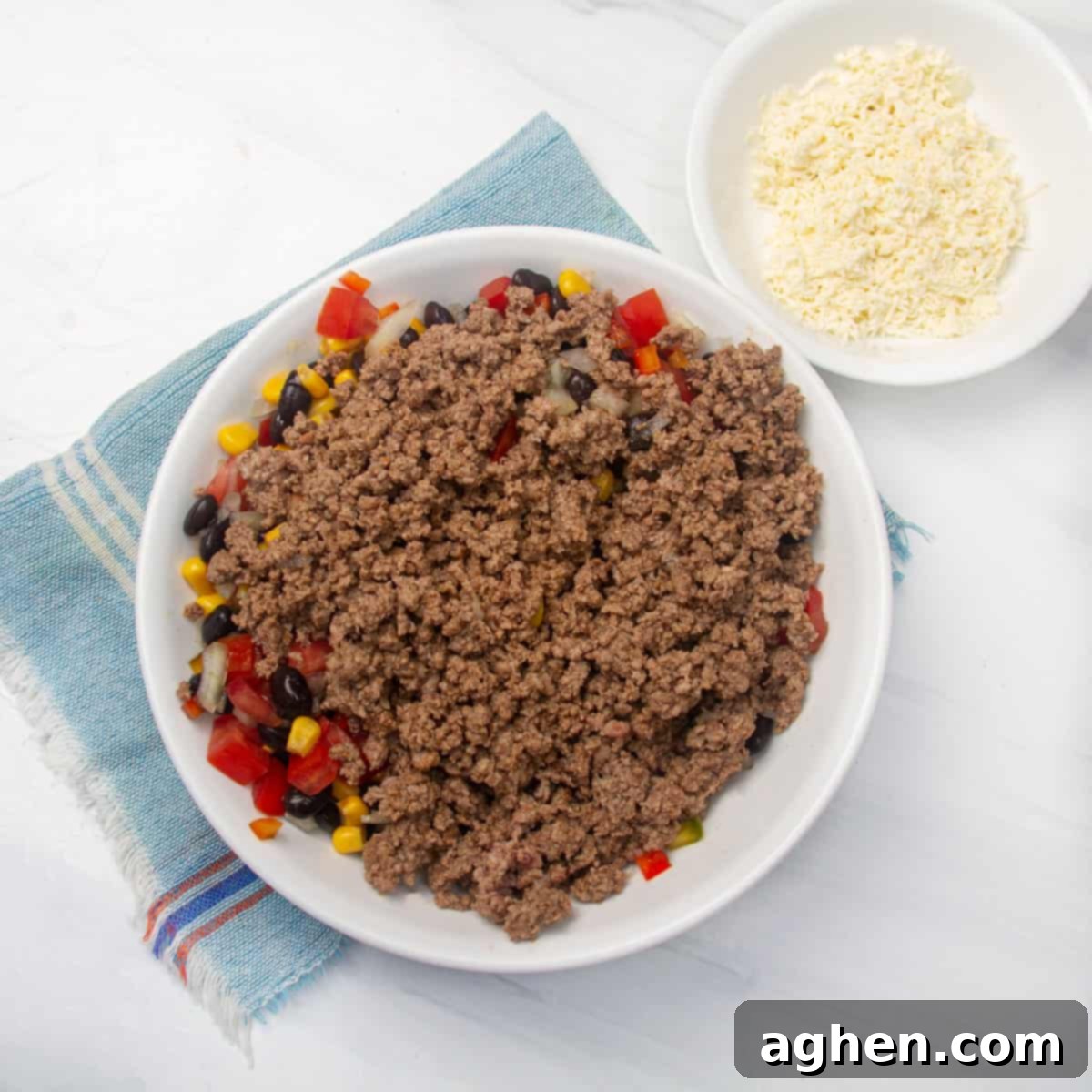 Simple Taco Casserole: Your Taco Night Game Changer 6 Cooked ground beef added to the mixture of beans and vegetables.
