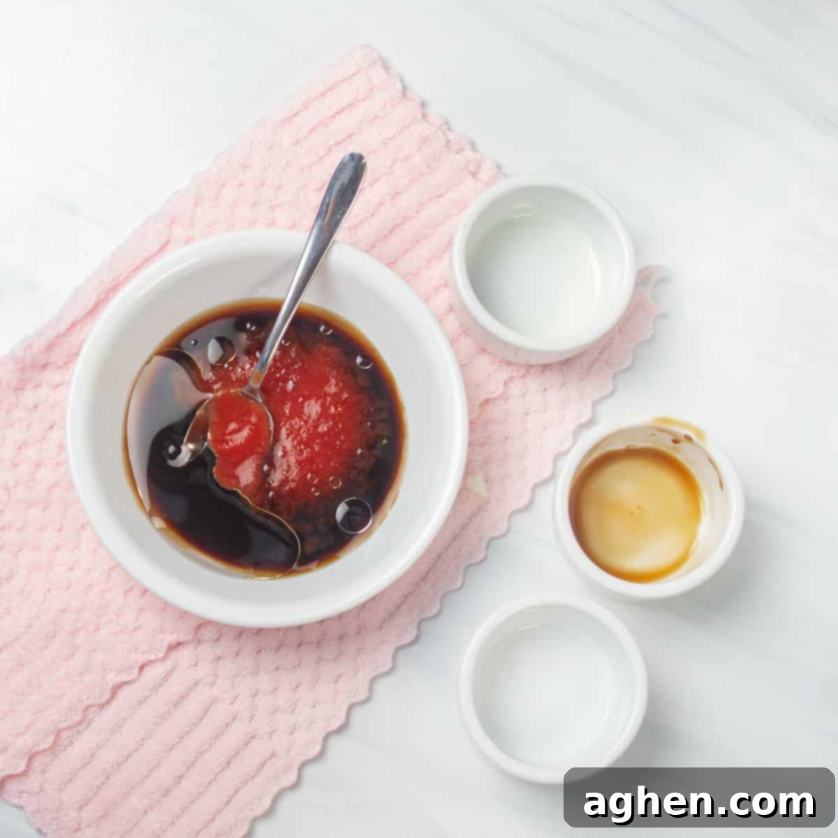 A small bowl containing the perfectly combined sauce for the Egg Roll in a Bowl, featuring reduced-sodium soy sauce, aromatic sesame oil, tangy rice vinegar, and a hint of spicy Sriracha sauce, ready to be added to the cooked ingredients.