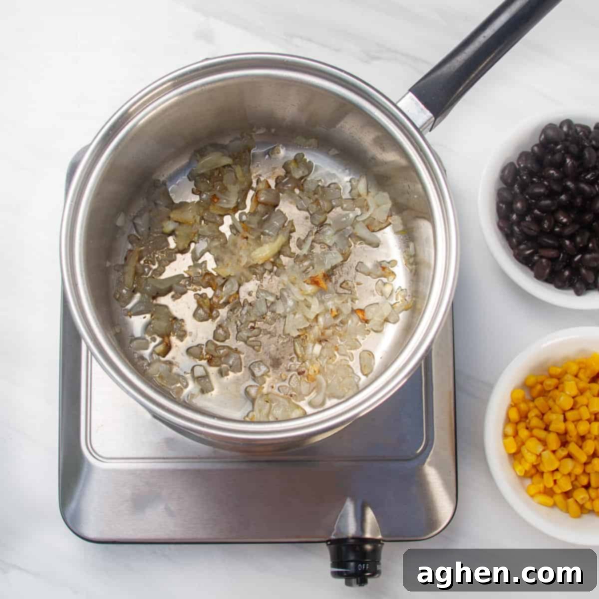 Speedy Skinny Chicken Tortilla Soup 4 Chopped garlic and onion actively cooking in a pan, releasing rich aromas.