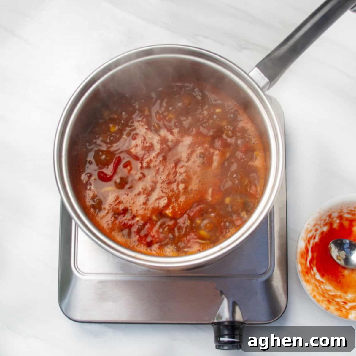 Speedy Skinny Chicken Tortilla Soup 6 All the delicious soup ingredients simmering together in a hot pan, allowing flavors to blend.