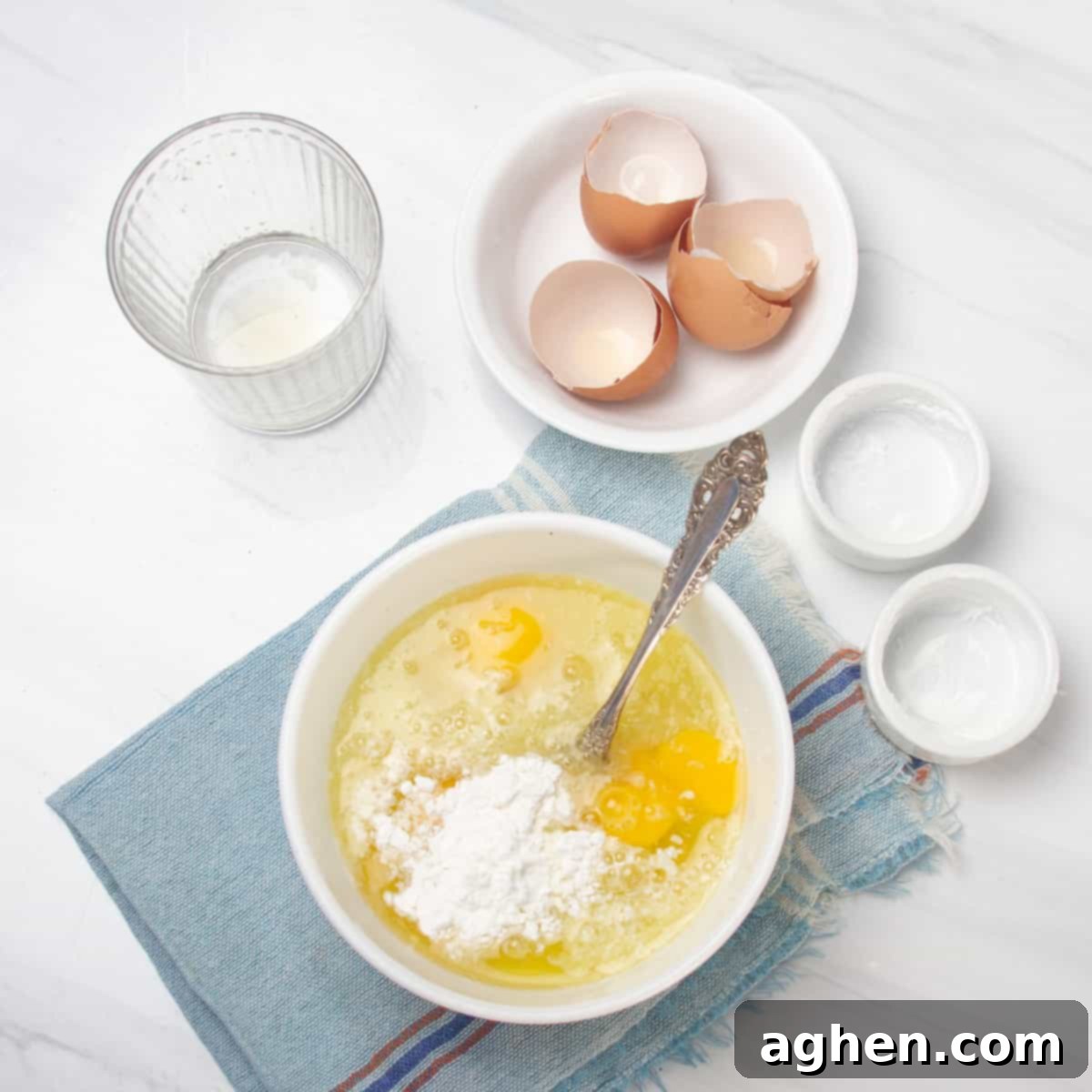 Sunshine Slice 3-Point Lemon Bars 5 Filling ingredients of fresh lemon juice, lemon zest, stevia, tapioca starch, and eggs combined in a bowl.