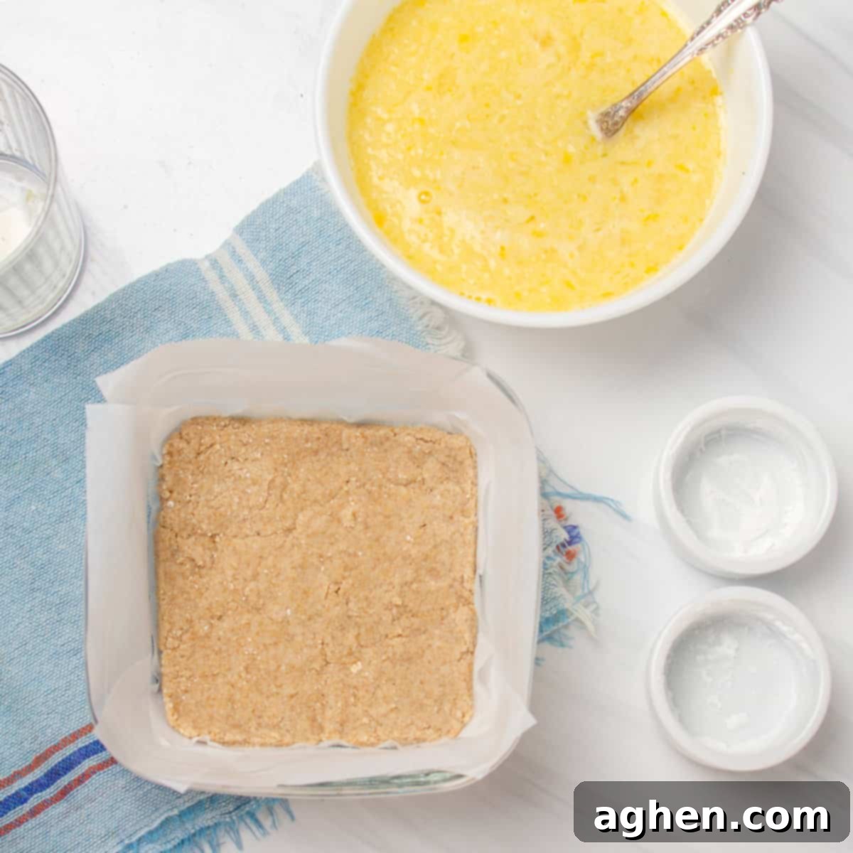 Sunshine Slice 3-Point Lemon Bars 6 The crust par-baked in a baking dish.