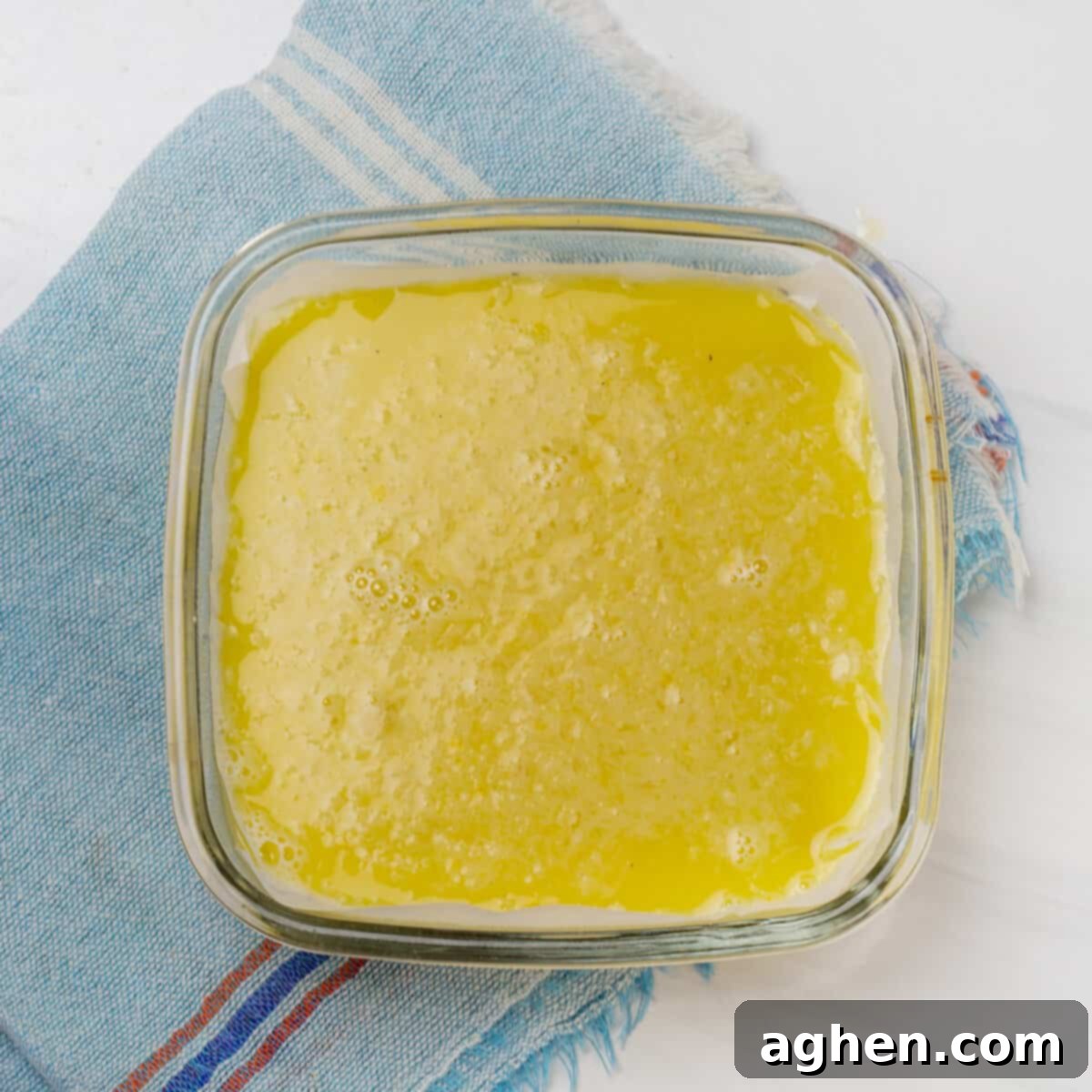Sunshine Slice 3-Point Lemon Bars 7 The filling mixture on top of the crust in the baking dish.