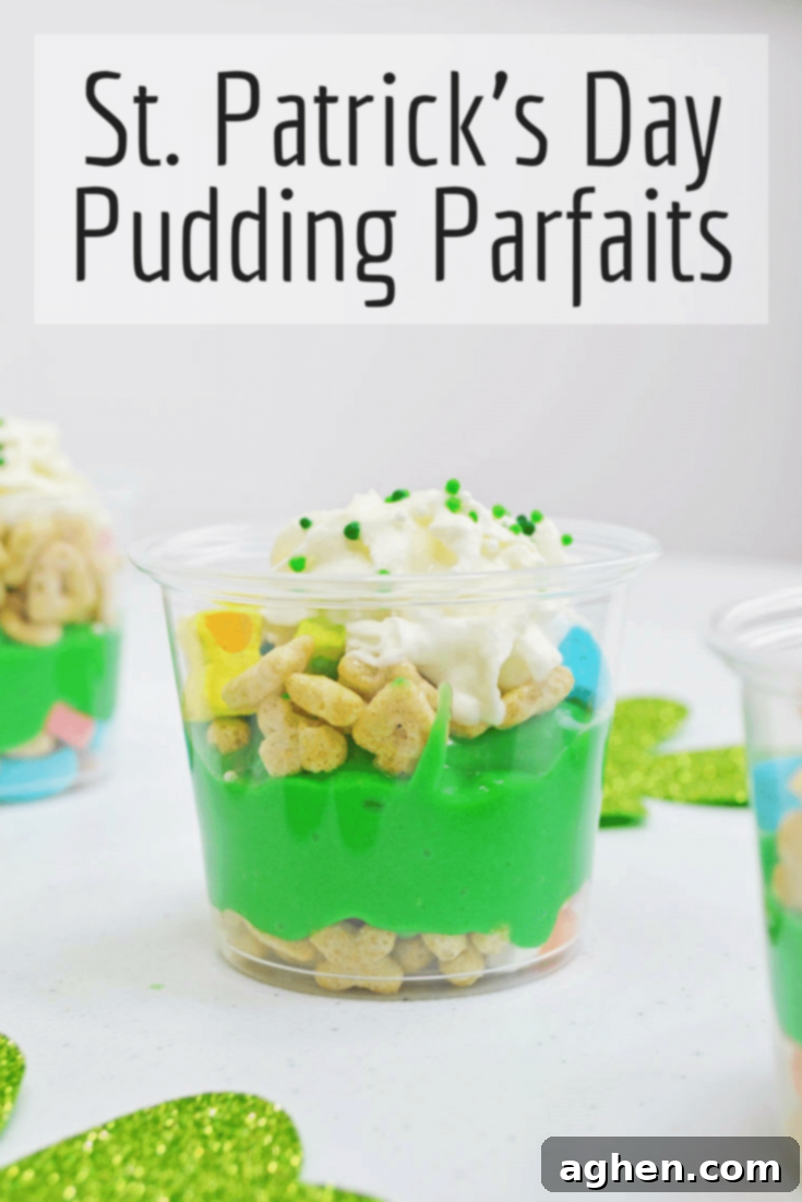 St. Patrick's Day Pudding Parfaits layered with Lucky Charms, green pudding, and whipped cream. Pin this easy, no-bake dessert recipe for later!