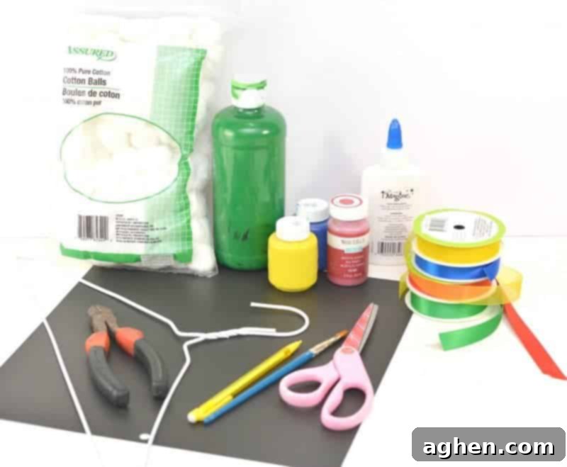 Supplies laid out for the hanging cotton ball rainbow craft.