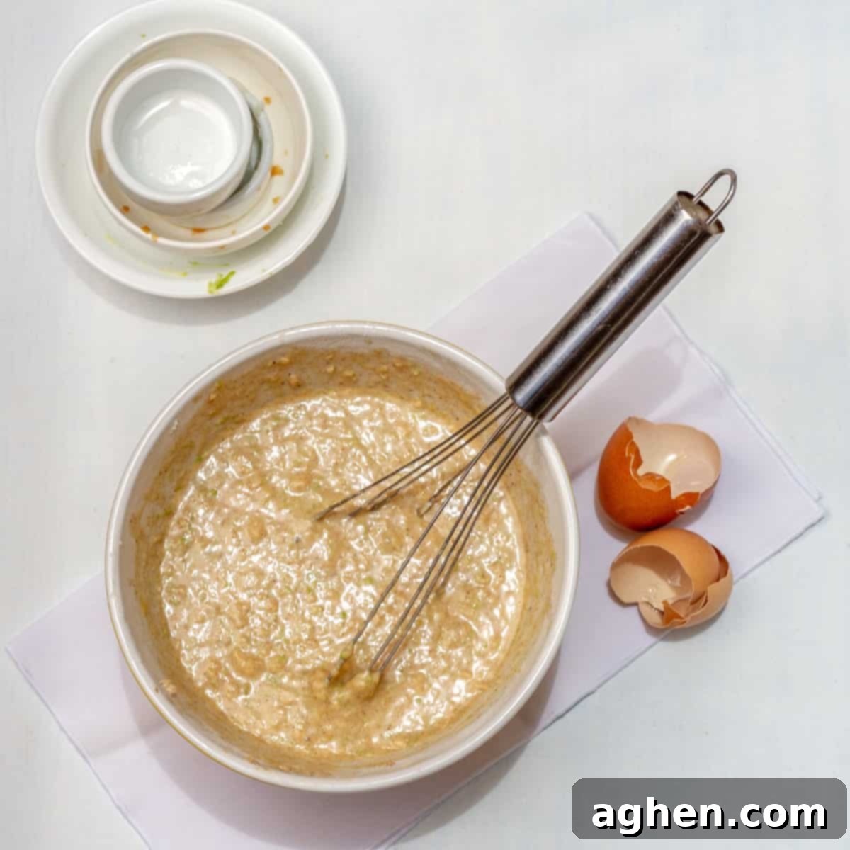 Irresistible Holiday Cinnamon Muffins 5 Eggs, grated apples, stevia, melted coconut oil, and vanilla extract whisked until well combined.