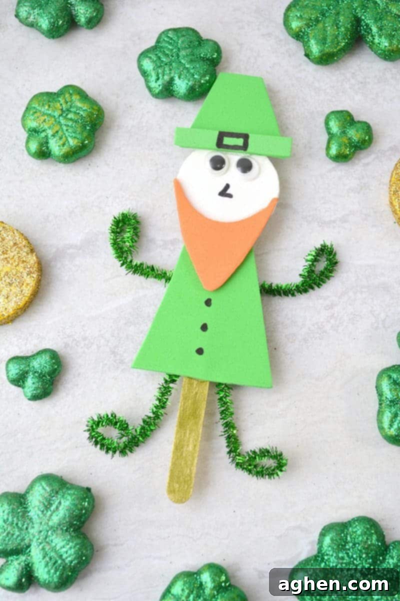 Close-up of a delightful popsicle stick leprechaun puppet, showcasing the details of its foam beard, hat, and googly eyes, ideal for a St. Patrick's Day activity.
