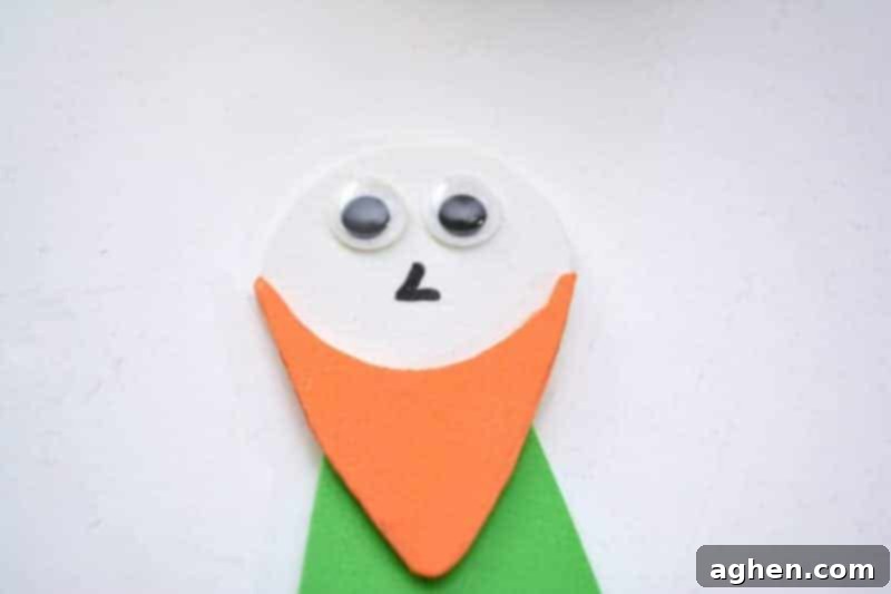 Step-by-step instruction: Drawing a small nose and gluing googly eyes onto the leprechaun's face, adding expressive features to the St. Patrick's Day craft.