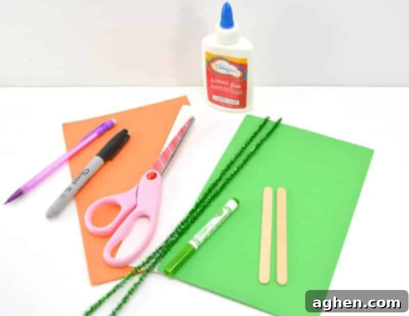 Array of craft supplies neatly laid out: popsicle sticks, colorful craft foam, googly eyes, glue, markers, and pipe cleaners for a St. Patrick's Day leprechaun craft.